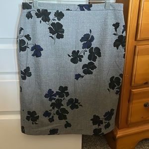 Ann Taylor grey skirt with black and blue flowers.
